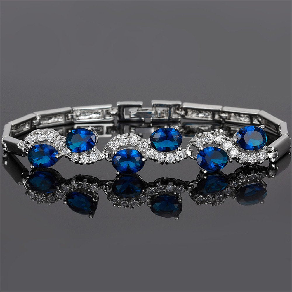 RIZILIA Tennis Bracelet & Oval Cut CZ [6 Colors available] in White Gold Plated, 7"