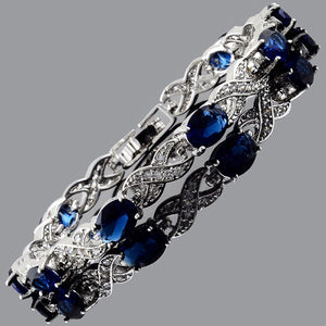 RIZILIA Oval Cut Multi-Color CZ 18K Gold Plated Tennis Bracelet, 7"